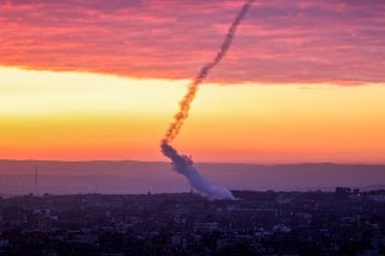 Trails of smoke are seen as rockets are fired from Gaza toward Israel.