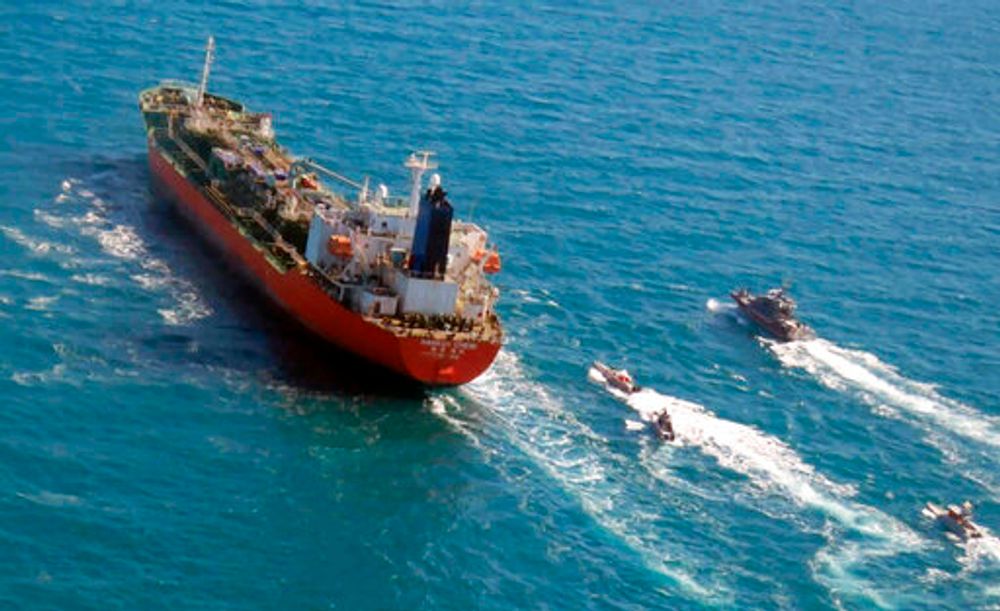 FILE - South Korean-flagged tanker is escorted by Iranian Revolutionary Guard boats in the Persian Gulf, January 4, 2021.