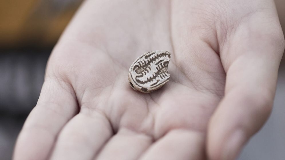 The ancient Egyptian amulet, held by 12-year-old Dafna Filshteiner