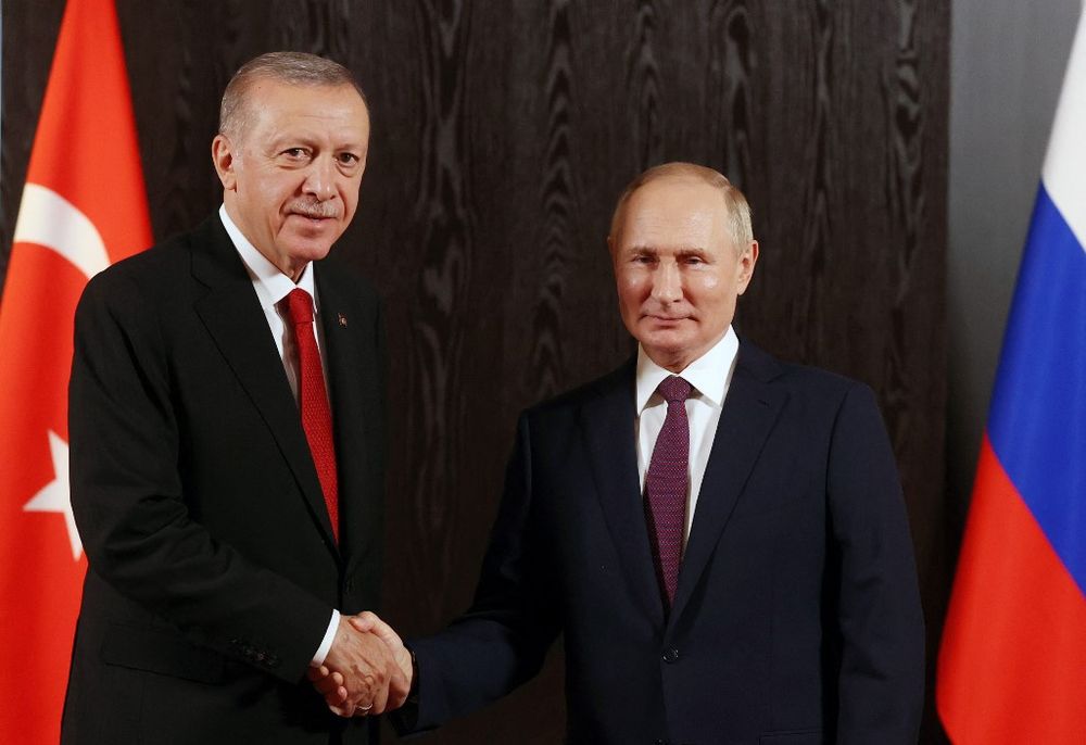 Russian President Vladimir Putin (R) meets with Turkish President Recep Tayyip Erdogan on the sidelines of the Shanghai Cooperation Organization leaders' summit in Samarkand, Uzbekistan, on September 16, 2022.