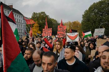 Protesters hold placards and flags during a pro-Palestinian rally in Berlin, Germany.