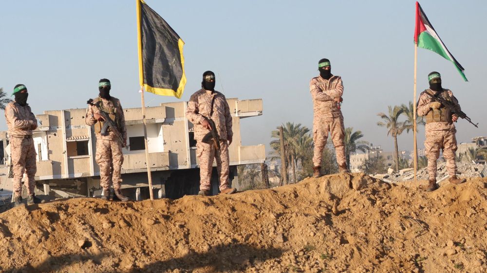 Hamas terrorists at the handover site during a hostage release ceremony
