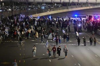 Israelis block the Ayalon Highway in Tel Aviv during a protest against the government's planned judicial overhaul.