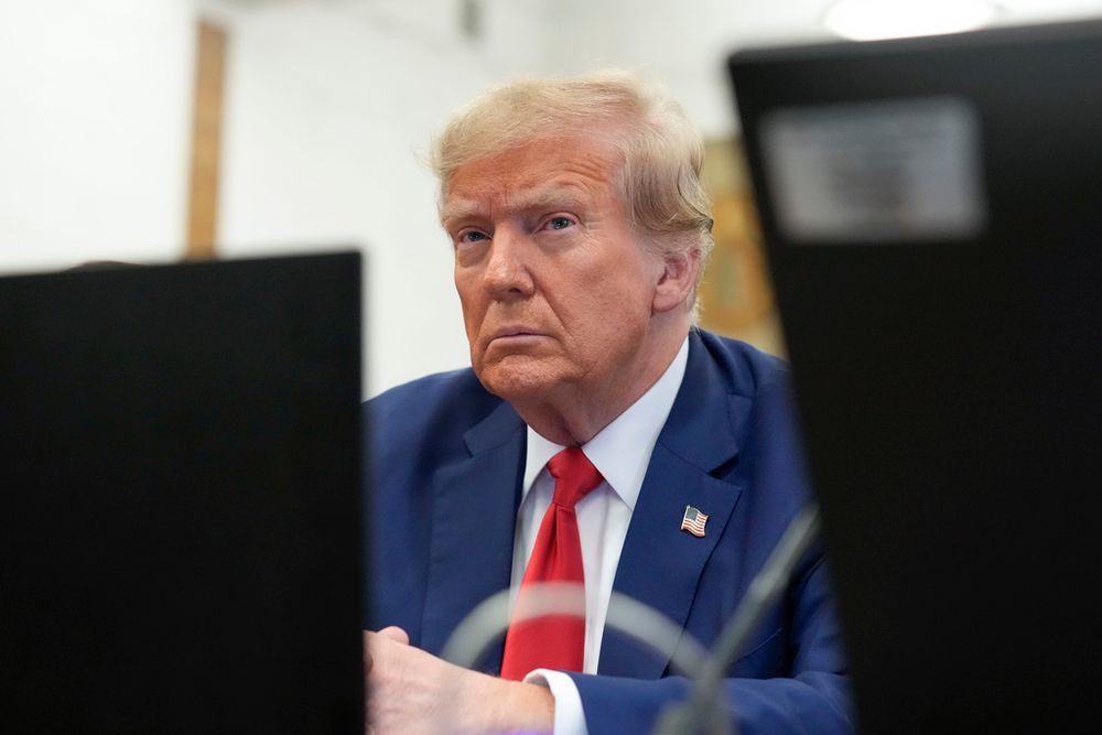 FILE - Former U.S. President Donald Trump sits in the courtroom at the New York Supreme Court.