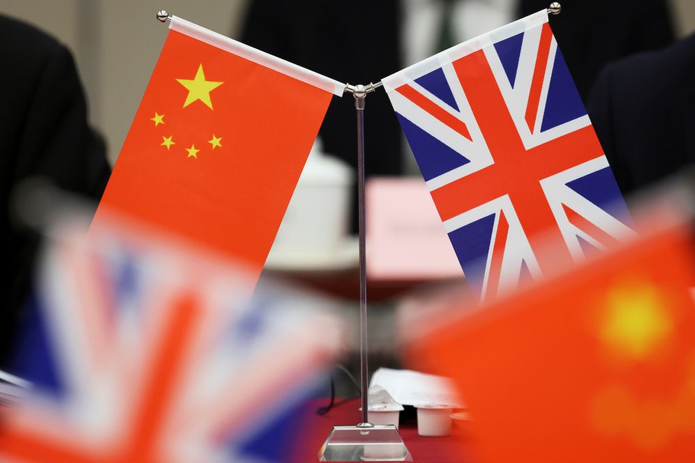 FILE - Flags of China and the Union Jack stand during the China-UK Energy Dialogue in Beijing, China, March 17, 2025.