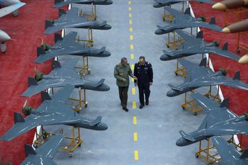 Iranian army commander General Abdolrahim Mousavi (left) speaks with Defense Minister General Aziz Nasirzadeh in a ceremony to deliver domestically-built drones to the army in an undisclosed location in Iran


