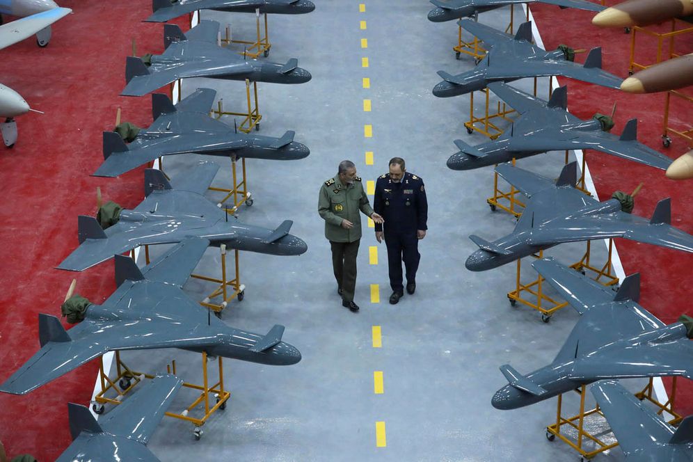 Iranian army commander General Abdolrahim Mousavi (left) speaks with Defense Minister General Aziz Nasirzadeh in a ceremony to deliver domestically-built drones to the army in an undisclosed location in Iran


