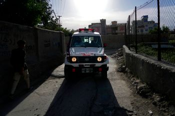 An ambulance carrying wounded people leaves the site of an explosion in Kabul, Afghanistan, on April 29, 2022.