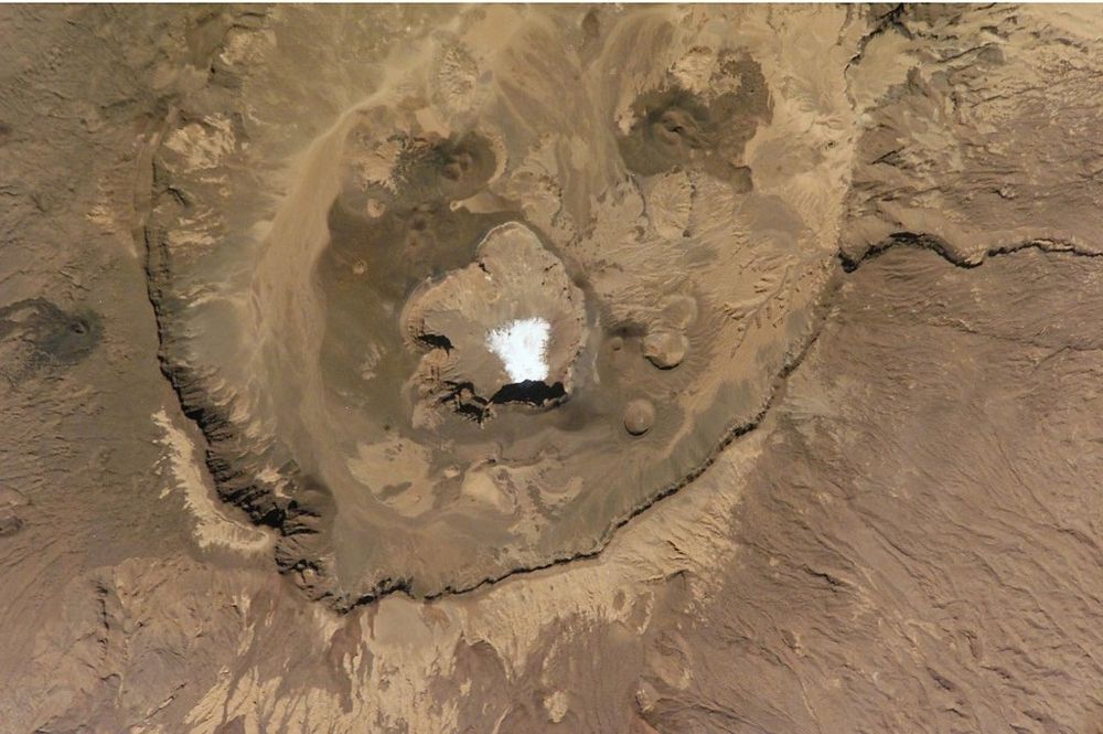 The Emi Koussi volcano that lies at the south end of the Tibesti Mountains in the central Sahara of northern Chad, obtained on December 10, 2002.