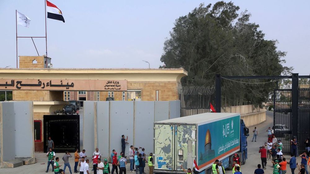 A truck carrying humanitarian aid for the Gaza Strip crosses the Rafah border gate in Rafah, Egypt.