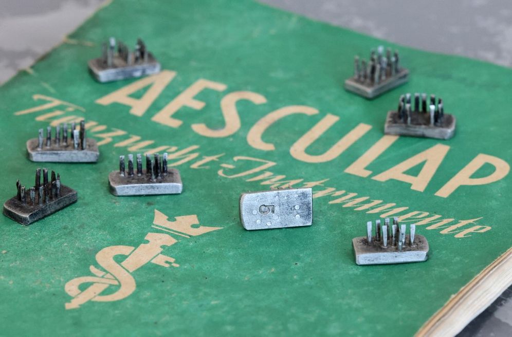 Tattoo stamps used by Nazis on Jewish and other inmates of Auschwitz are displayed by Tzolman’s auction house, in Jerusalem on November 8, 2021.