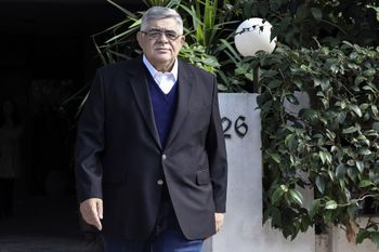 Leader of Greek neo-Nazi party Golden Dawn Nikos Michaloliakos speaks to the press outside his home in Athens on October 22, 2020.