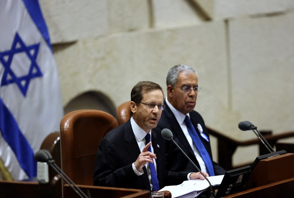 Israeli President Isaac Herzog (L) speaks during the swearing in ceremony of the new Israeli parliament in Jerusalem, on November 15, 2022.