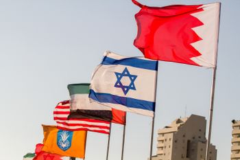 The flags of the U.S., United Arab Emirates, Israel and Bahrain seen on the side of a road in the city of Netanya, September 14, 2020.