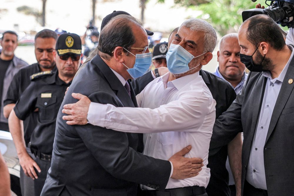 Yahya Sinwar, (right), Hamas' political chief in Gaza, embraces General Abbas Kamel, Egypt's intelligence chief, as the latter arrives for a meeting with leaders of Hamas in Gaza City on May 31, 2021.