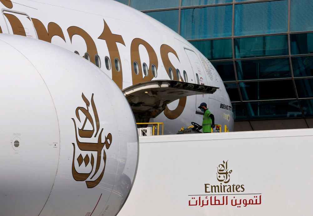 A picture shows an Emirates Airlines plane being unloaded the Dubai International Airport on February 1, 2021.