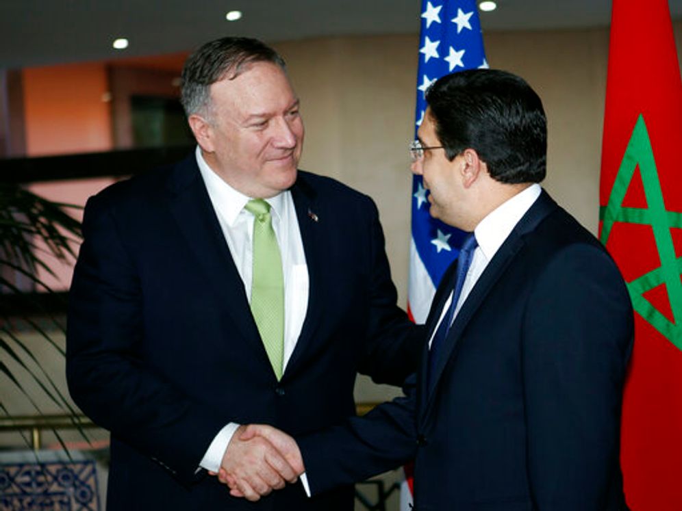 Secretary of State Mike Pompeo shakes hands with Moroccan Foreign Minister Nasser Bourita, as they meet the media before a private meeting at the Foreign Minestry in Rabat, Morocco, Thursday, Dec. 5, 2019.