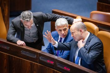 Israel's Prime Minister Naftali Bennett (L), Foreign Minister Yair Lapid and lawmaker Boaz Toporovsky during a vote on a bill to dissolve the Knesset, at the assembly hall of the Israeli parliament, in Jerusalem, Israel, on June 22, 2022.