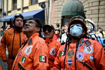 Mexican rescuers look at damages in a building after in Mexico City after an earthquake on September 19, 2022