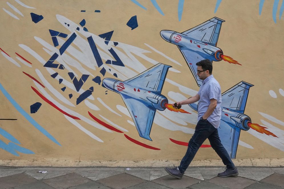 AP Photo/Vahid Salemi A man walks past an anti-Israel mural in downtown Tehran, Iran, Sunday, May 17, 2026.