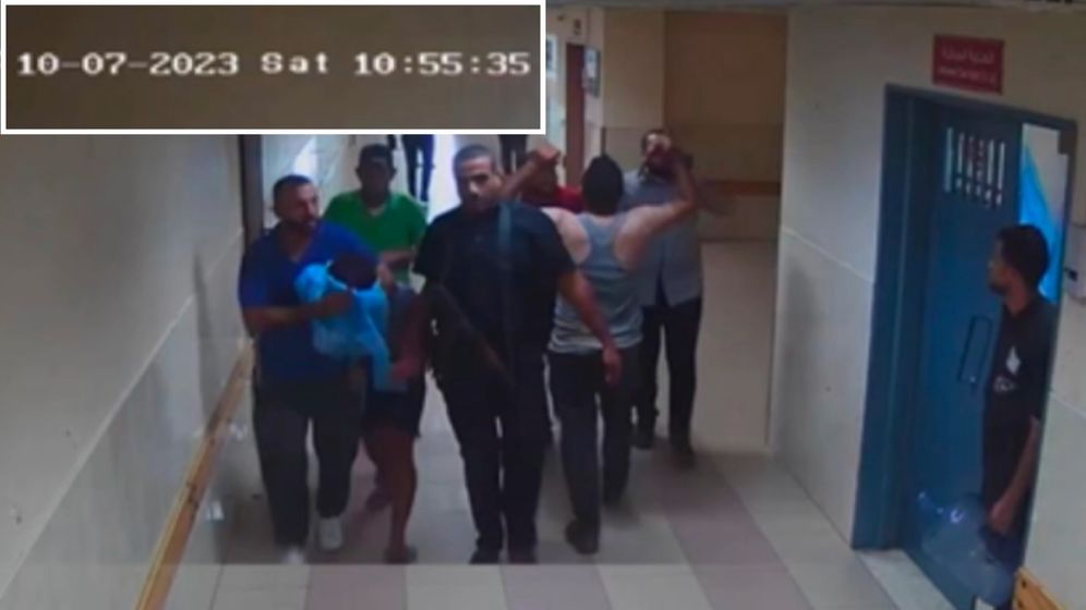 CCTV footage showing Hamas terrorists leading a hostage through a corridor in the Shifa hospital.