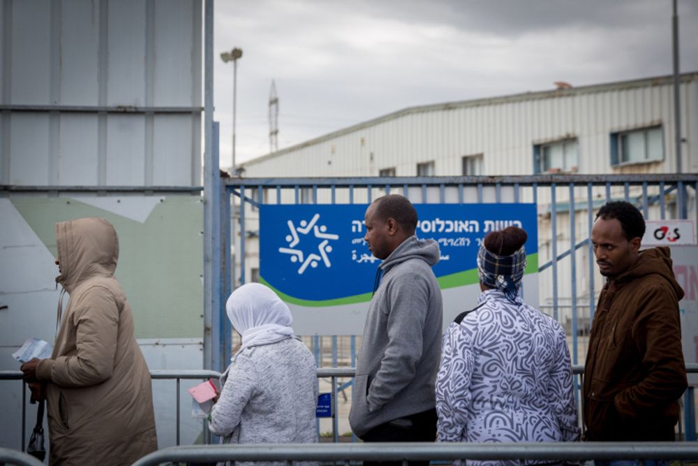 African asylum seekers wait outside the Israeli Population and Immigration Authority office in Bnei Brak, Israel, on February 13, 2018.
