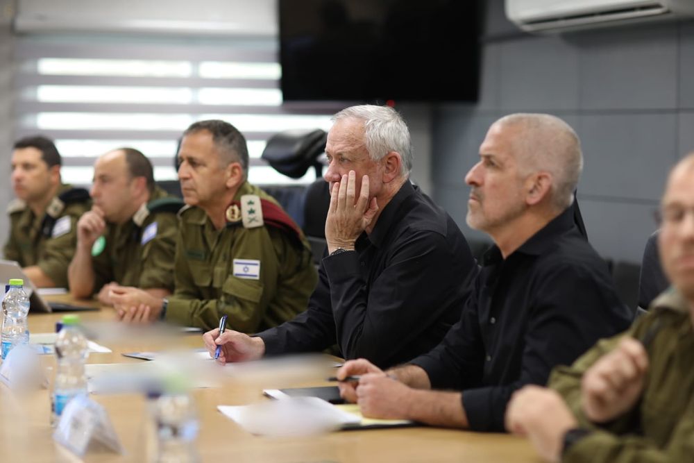 Israel's Defense Minister Benny Gantz (C) in a meeting with army Chief of Staff Aviv Kochavi (L) and Shin Bet Chief Ronen Bar in southern Israel, on April 24, 2022.