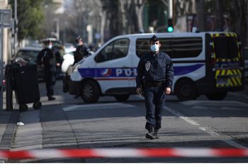 Police officers cordon off the area after a man visibly brandished a knife outside a Jewish school and a kosher market in Marseille, southern France, on March 5, 2021.