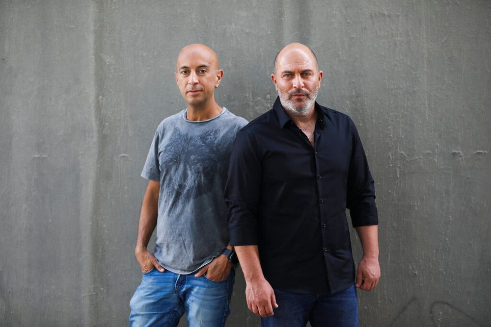 Co-creators of Israel's hit TV show "Fauda" Avi Issacharoff (L) and Lior Raz pose for a photo in Tel Aviv, Israel.