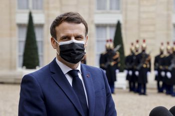 French President Emmanuel Macron, wearing a face mask, talks to the press before a meeting with the Serbian President at the Elysee Presidential Palace in Paris, on February 1, 2021.