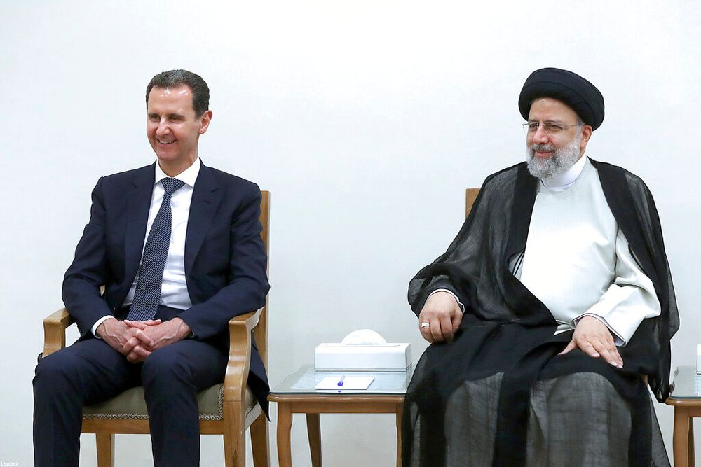 Syrian President Bashar al-Assad (L) with his Iranian counterpart Ebrahim Raisi in Tehran, Iran.