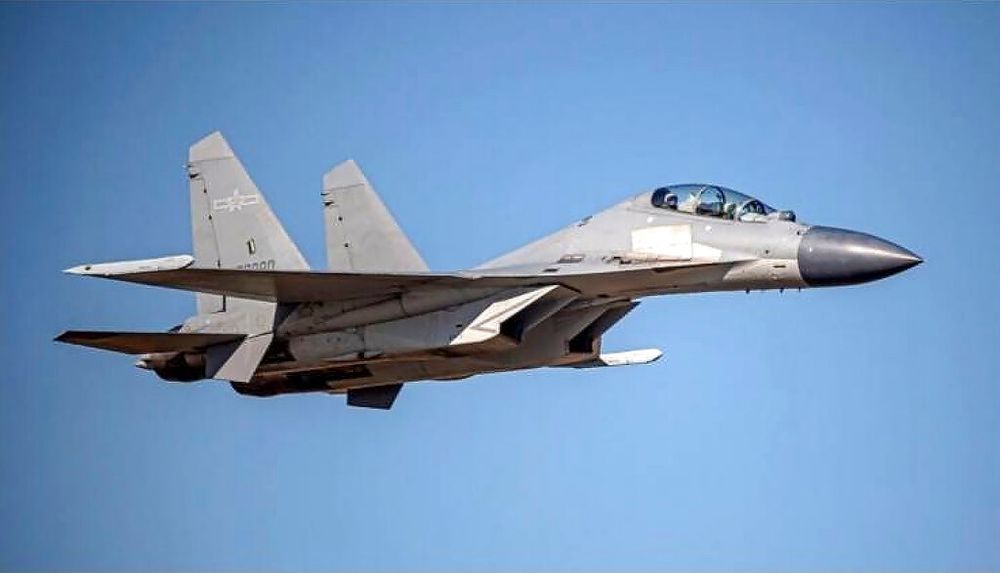 In this undated file photo released by Taiwan's Defense Ministry, a Chinese PLA J-16 fighter jet flies in an undisclosed location.