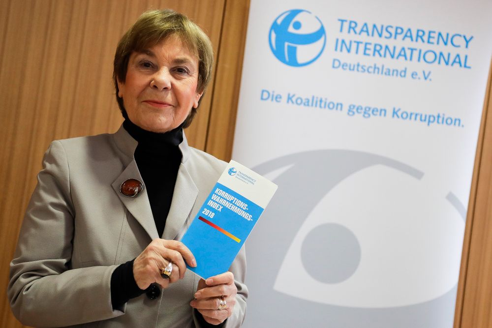 Edda Mueller, chairwoman of Transparency International Germany e.V. poses for the media with the Corruption Perceptions Index 2018, prior to the presentation of the yearly report at a news conference in Berlin, Germany, Tuesday, Jan. 29, 2019.