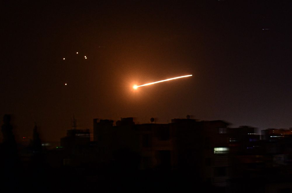 A handout picture released by the official Syrian Arab News Agency (SANA) on February 24, 2020, reportedly shows Syrian air defense intercepting an Israeli missile in the sky over the Syrian capital Damascus.