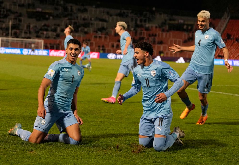 AP Photo/Ricardo Mazalan Israel's Anan Khalaili (L) celebrates with teammate Hamza Shibli after scoring their team's first goal against Uzbekistan during a FIFA U-20 World Cup in Mendoza, Argentina.