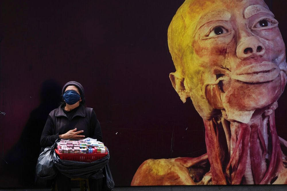 A cigarette vendor wears a protective face mask as a precaution against Covid, in Quito, Ecuador, on April 29, 2022.