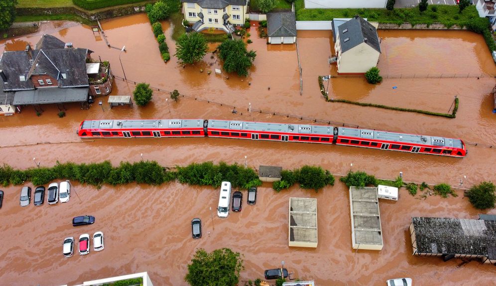 A regional train stands in the train station of the town of Kordel, flooded by the water of the river Kyll, western Germany, following heavy rains, July 15, 2021.