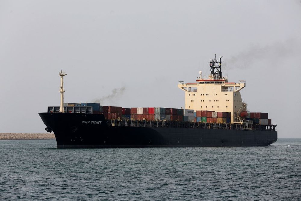 File photo of an Iranian cargo ship sails through the Shahid Beheshti Port in the Gulf of Oman.
