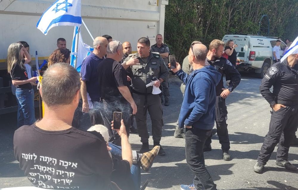 Protesters and police interact during demonstrations against the presence of National Security Minister Itamar Ben-Gvir, in Kfar Uria, Israel.