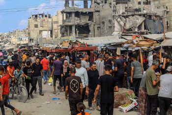 Palestinians shop at a market in Khan Yunis, in the southern Gaza Strip, September 25, 2026. 