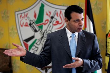 File photo of Mohammad Dahlan gesturing in his office in the West Bank city of Ramallah