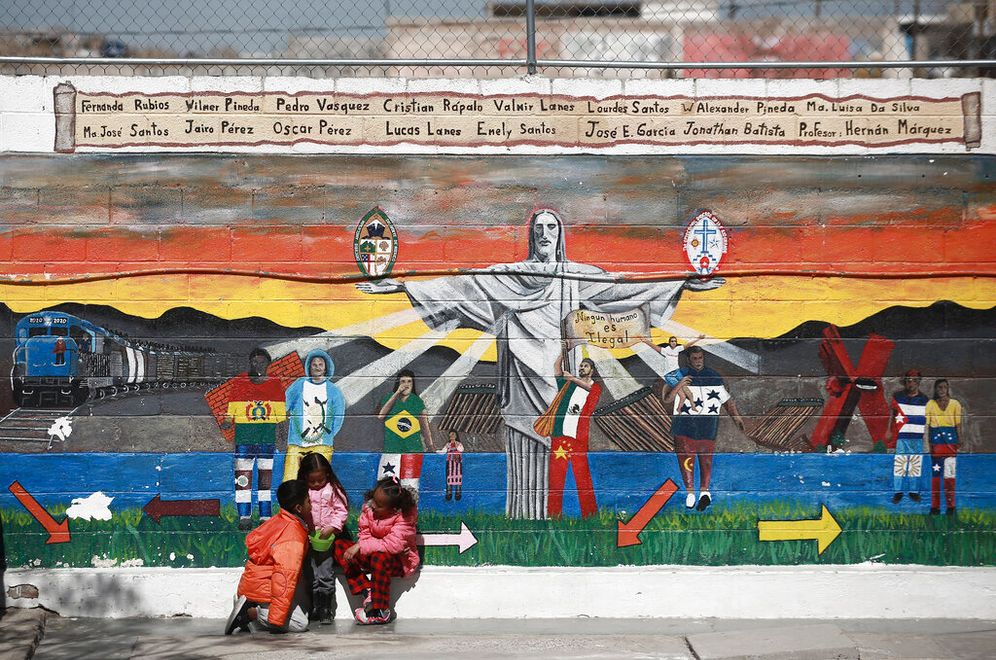 Migrant children sit outside the San Matias shelter in Ciudad Juarez, Mexico, on February 9, 2022.