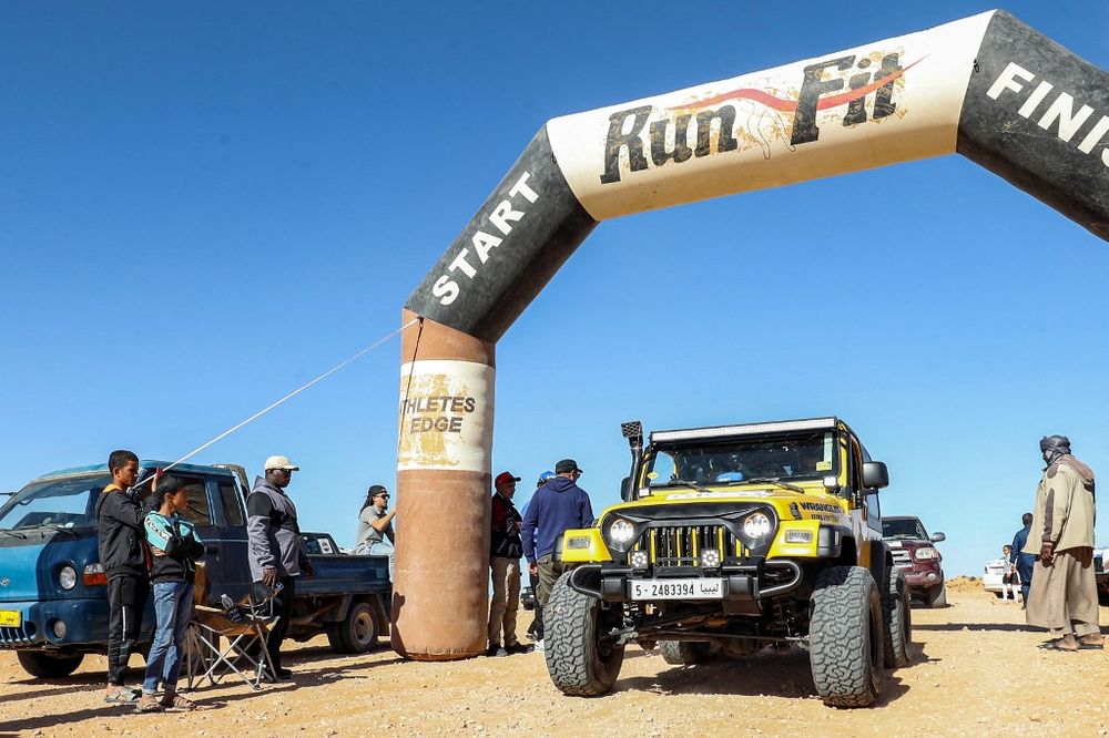 A driver takes part in the Hamada al-Hamra auto rally held in the area of Zintan, southwest of Libya's capital Tripoli, on November 10, 2022.