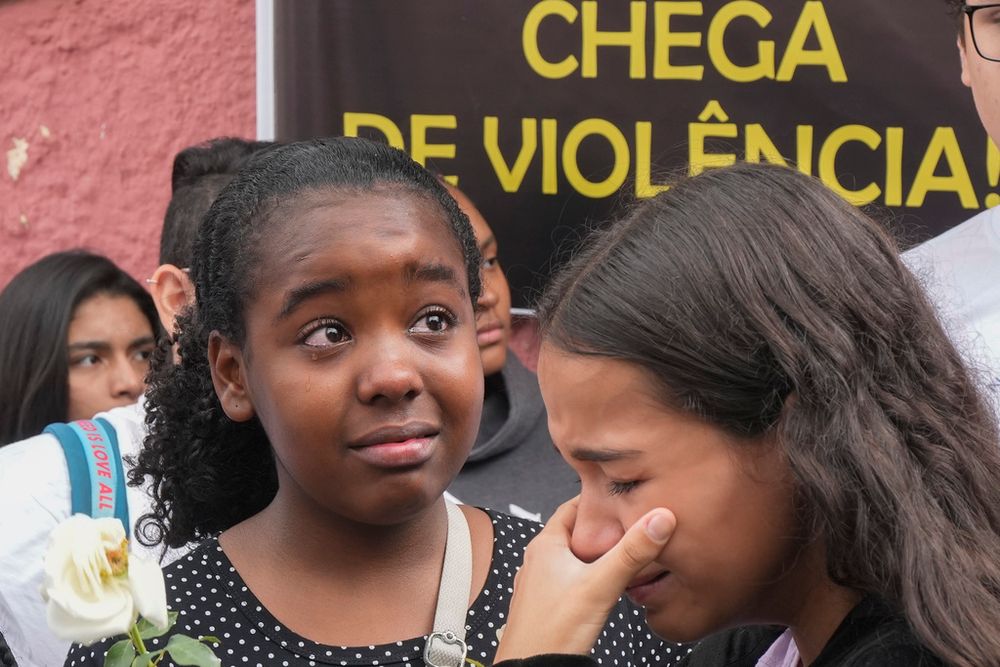 Helloisa Bastos de Carvalho, a student at the Thomazia Montoro public school attends a vigil for peace the day after a fatal stabbing at her school in Sao Paulo, Brazil.