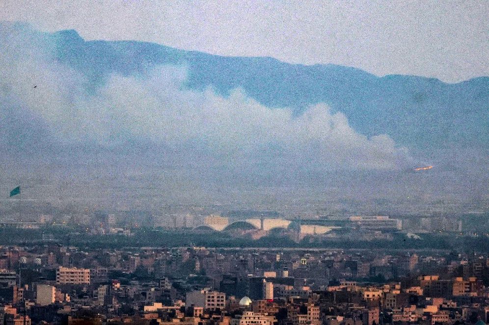 Atta KENARE / AFP Smoke and flames rise from the site of a suspected Israeli attack in southern Tehran, June 13, 2025.