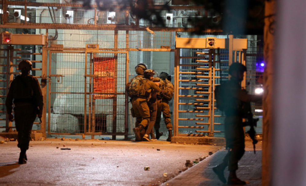 IDF detaining Palestinian near the West Bank