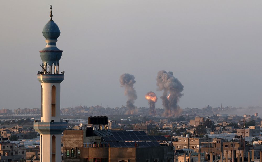 Smoke and flames rise after an Israeli airstrike iin the southern Gaza Strip, amid the most intense Israeli-Palestinian hostilities in seven years. May 12, 2021.