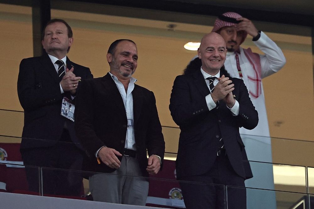 FIFA President Gianni Infantino (R) and Jordan's Prince Ali Al Hussein (L) attend the FIFA Arab Cup 2021 group C football match at the Education City Stadium in Ar-Rayyan, Qatar, on December 1, 2021.
