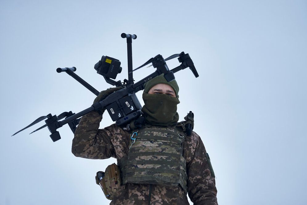 AP Photo/Libkos A Ukrainian soldier carries a drone close to the frontline near Avdiivka, Donetsk region, Ukraine.