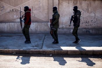 FILE - U.S. backed Syrian Democratic Forces soldiers search for Islamic State militants in Hassakeh, Syria.